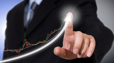 Businessman Touching A Graph Indicating Growth Picture Id973778602