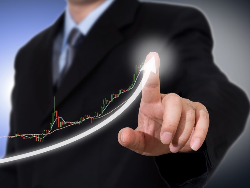 Businessman Touching A Graph Indicating Growth Picture Id973778602