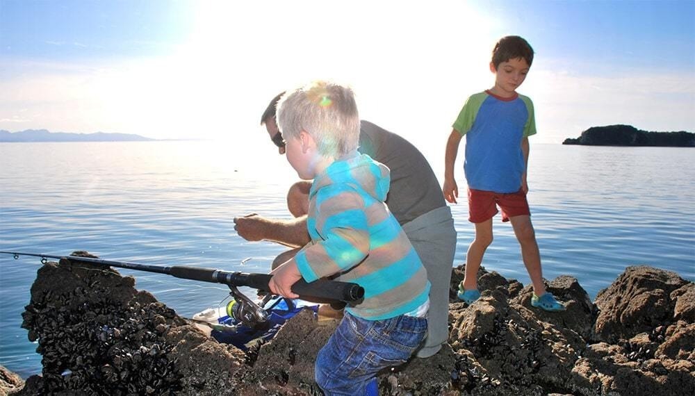 Children fishing rocks